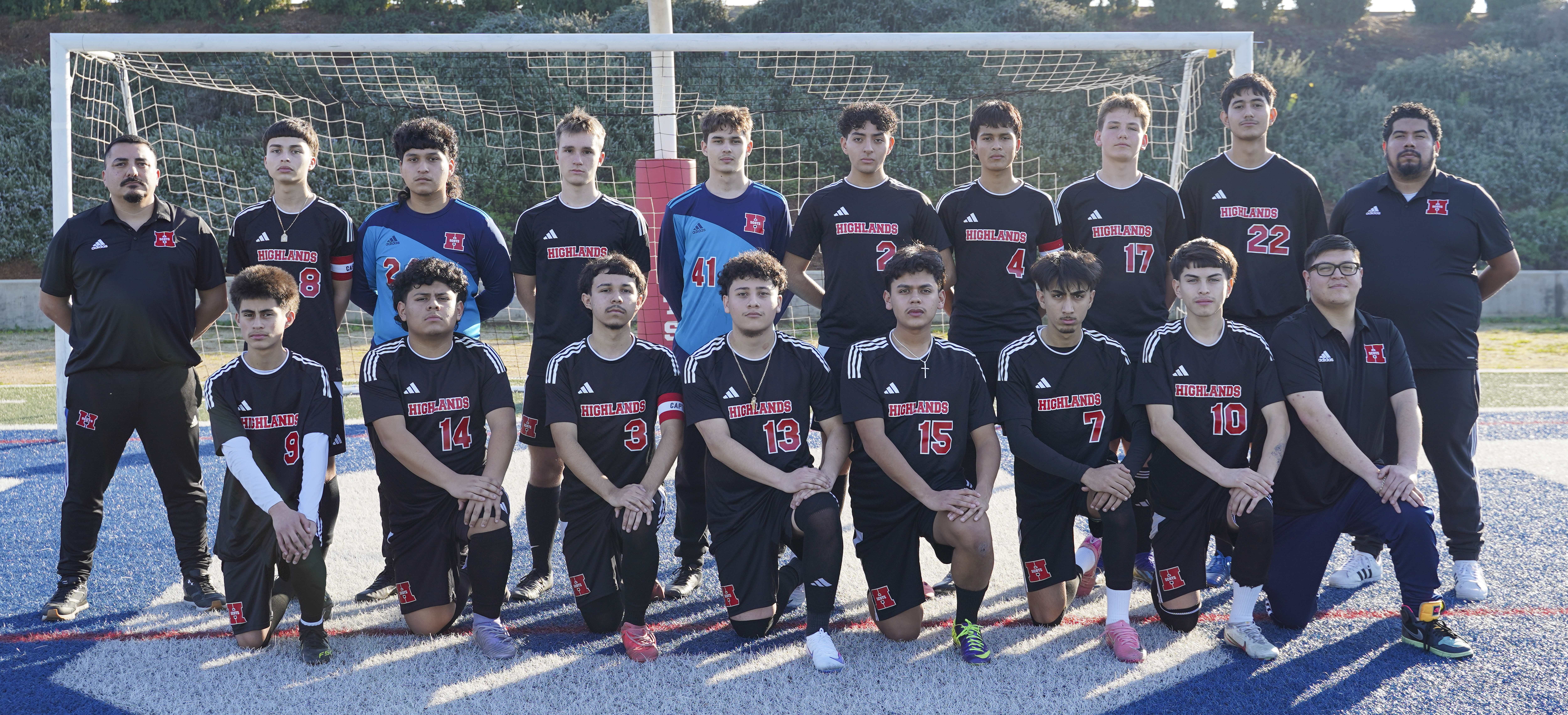 VARSITY BOYS SOCCER TEAM PHOTO IN FRONT OF THE GOAL