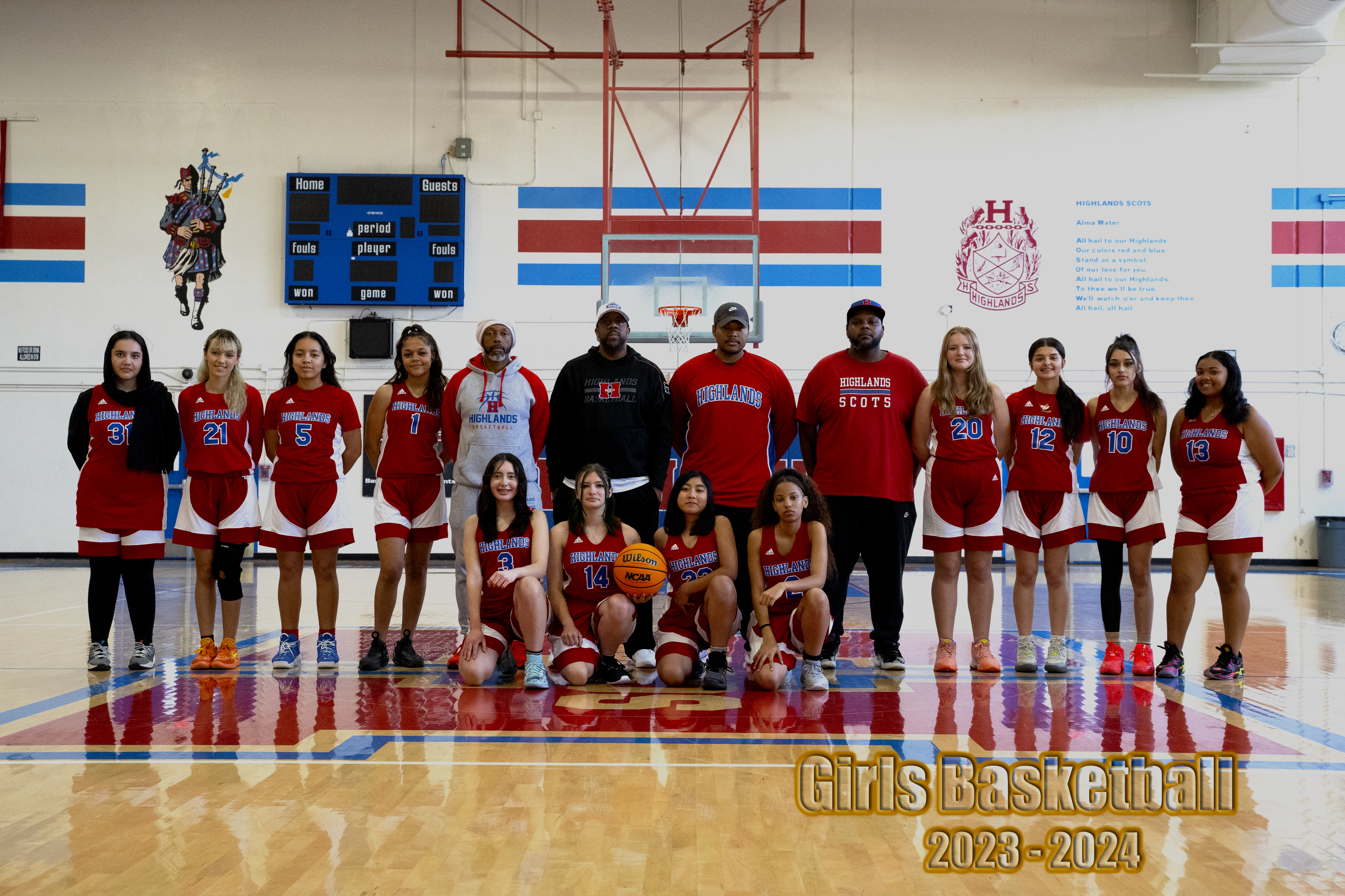 girls basketball team photo in gym
