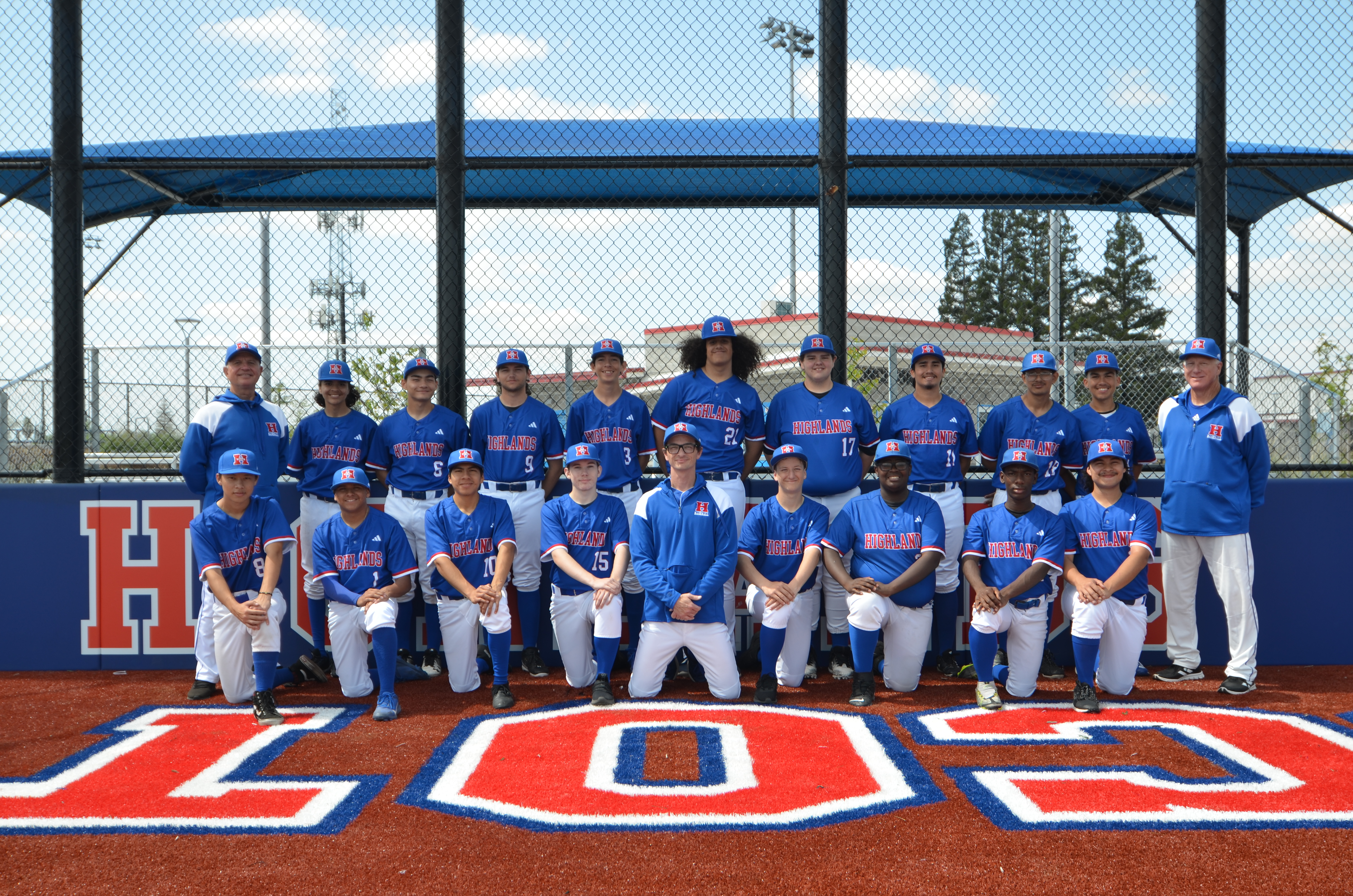 Baseball team photo behind home plate