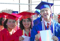 students smiling during graduation